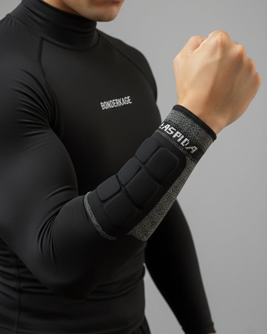 Bonderkage A9 cut-resistant wrist sleeve with integrated forearm padding worn over a base layer.